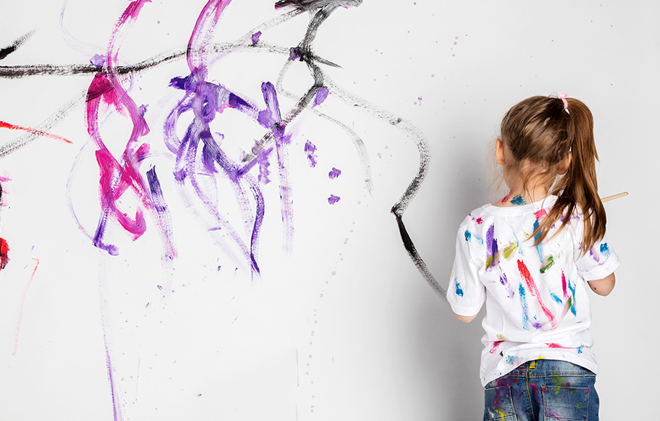 Kid Painting on White Wall