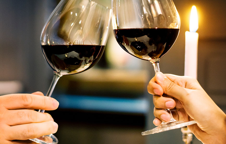 Couple making a toast with their wine glasses